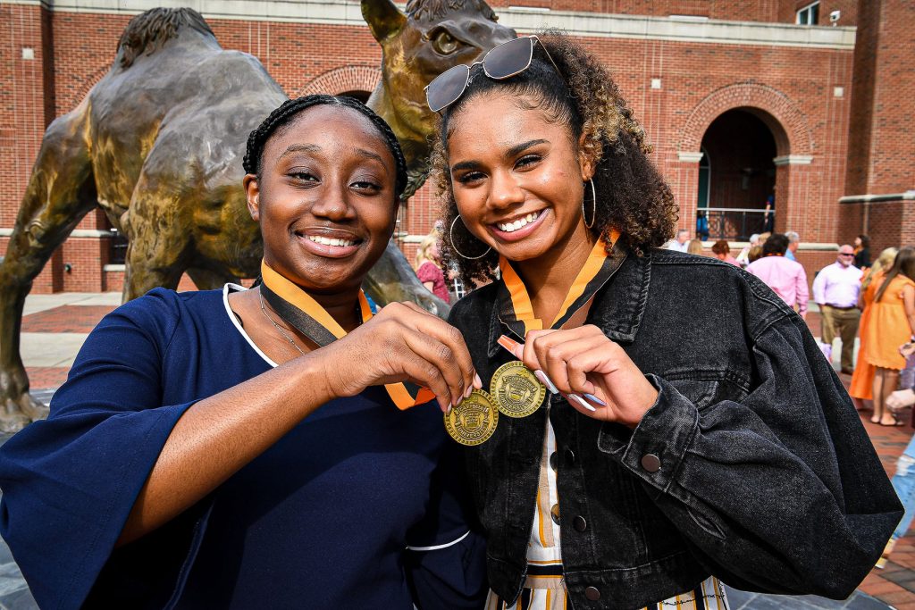 Women holding medals