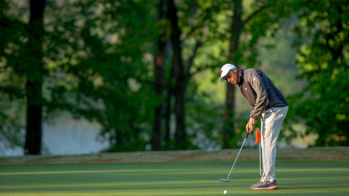 A Campbell golfer makes a putt